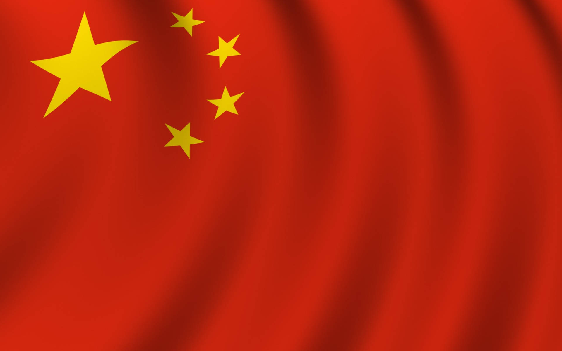 中國國旗在風中飄揚，紅色背景，黃色星星。