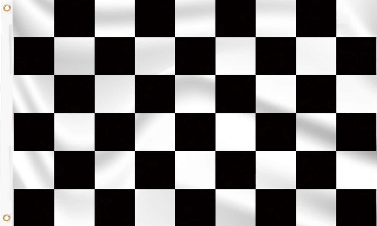 Chequered Flag 桌布 壁紙 — 一面黑白格子賽車旗在風中飄揚，可見布料摺痕和旗桿上的金屬環。