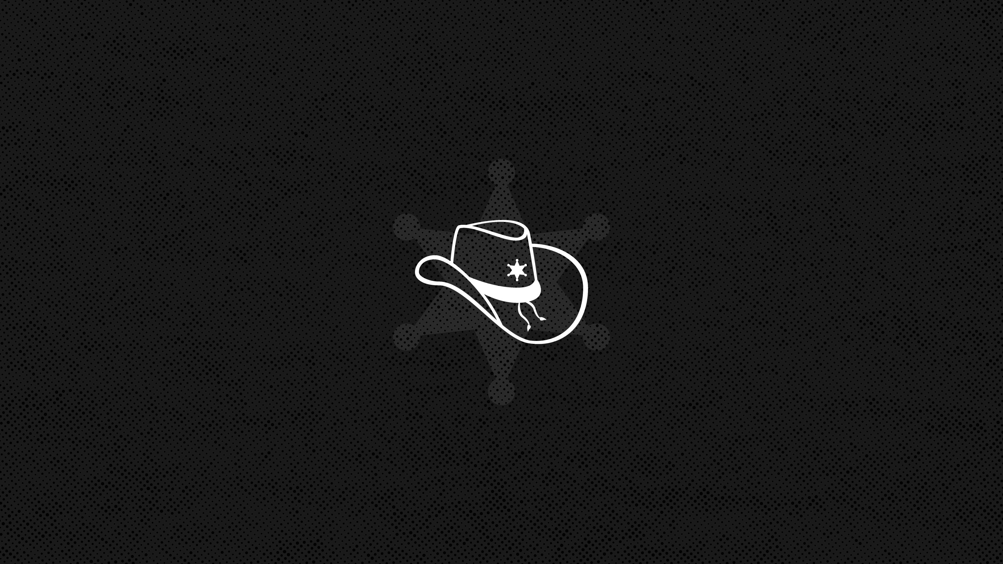 Cowboy 桌布 壁紙 — 一頂簡約的白色牛仔帽，中央帶有星星標誌，置於有紋理的黑色背景上。