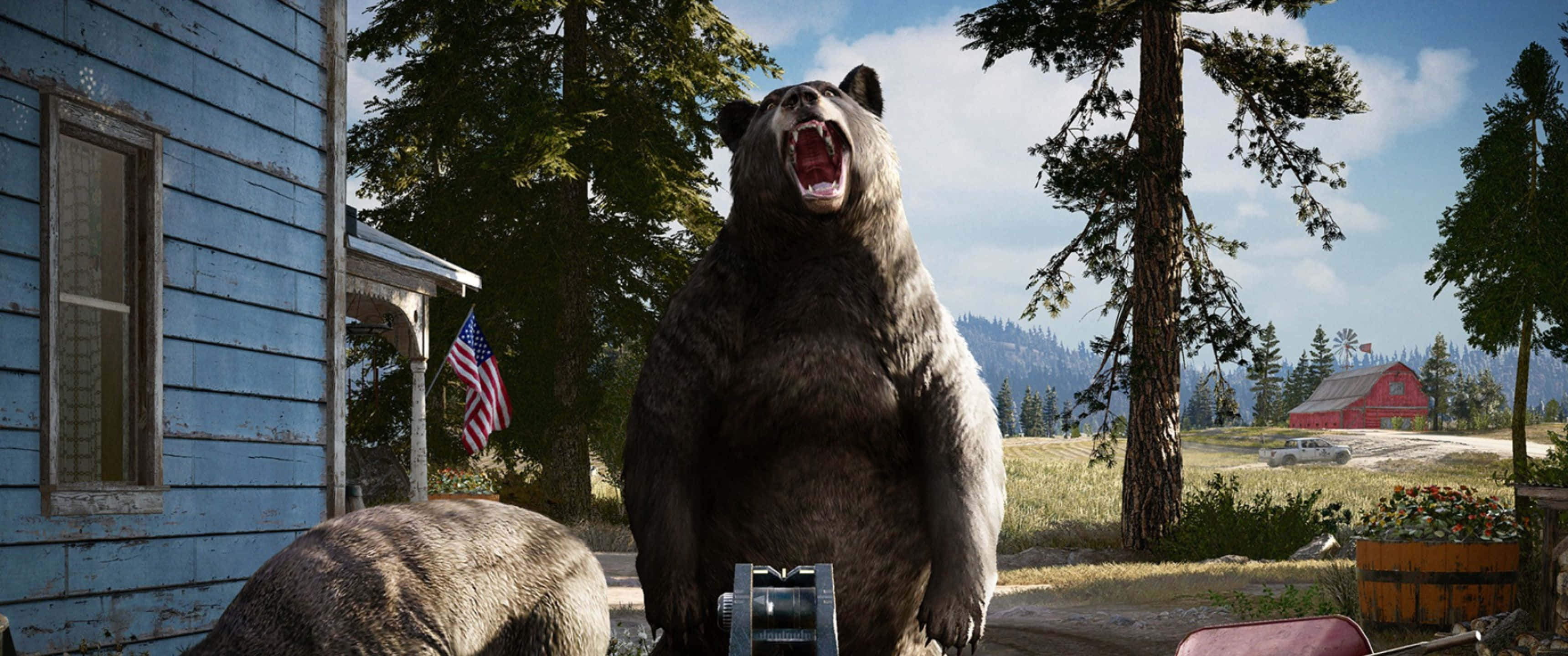 3440x1440p Far Cry 5 桌布 壁紙 — 一頭巨大的灰熊在飽經風霜的藍色小屋前挑釁地咆哮，附近有美國國旗飄揚。
