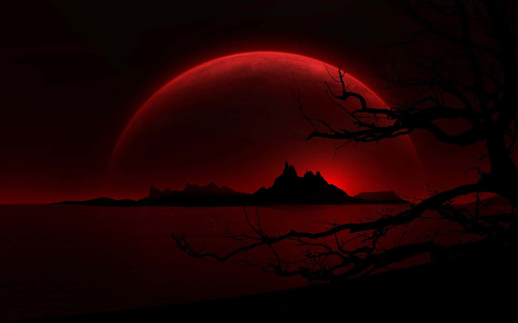 Cool Dark Desktop 桌布 壁紙 — 一顆令人難忘的紅色星球，在深紅色的天空下，籠罩著鋸齒狀山脈和光禿樹枝的黑暗剪影。