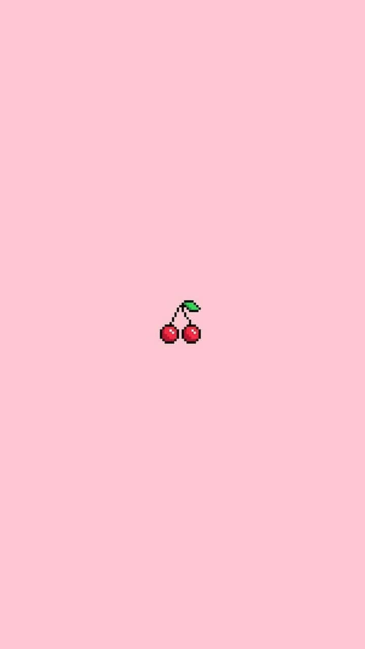 Cherry Aesthetic 桌布 壁紙 — 一顆像素化的櫻桃，帶有綠色葉子，位於柔和的粉紅色背景中央。
