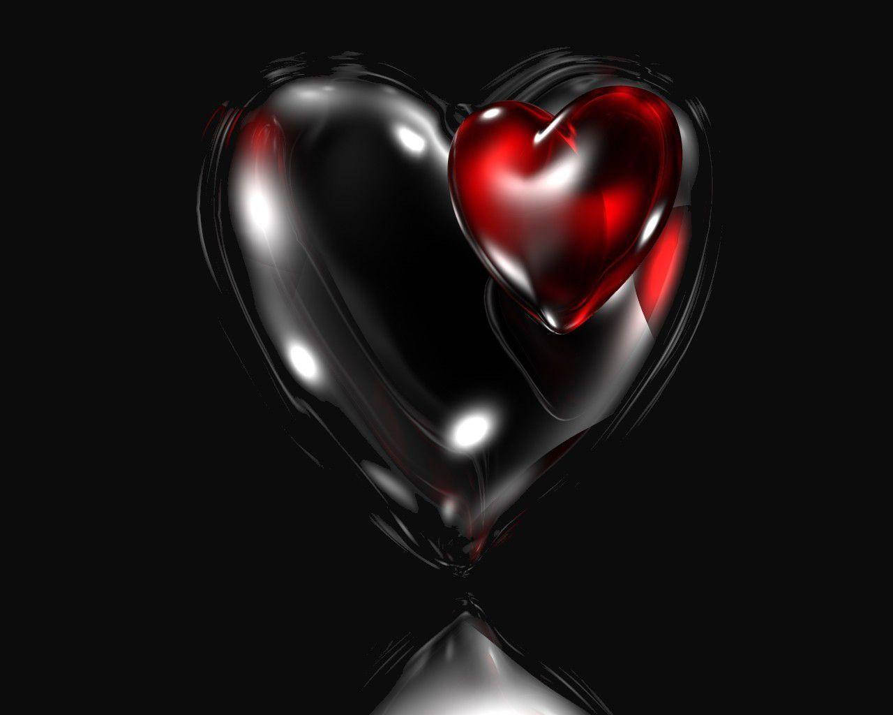 Dark Heart 桌布 壁紙 — 一顆光滑的黑色心臟在黑暗虛空中懷抱著一顆鮮紅的心臟，帶有反射高光。