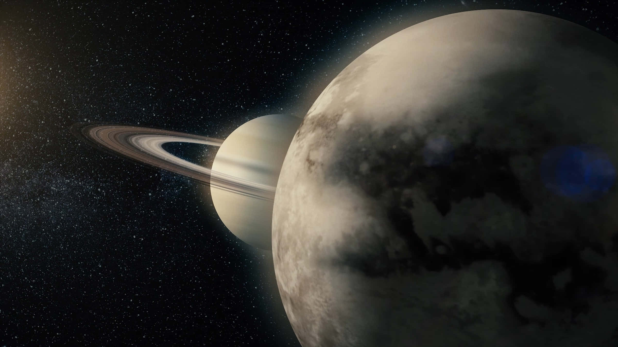 土星 桌布 壁紙 — 一顆壯麗的環狀行星在繁星點點的宇宙背景下，在一顆巨大的衛星旁邊發光。