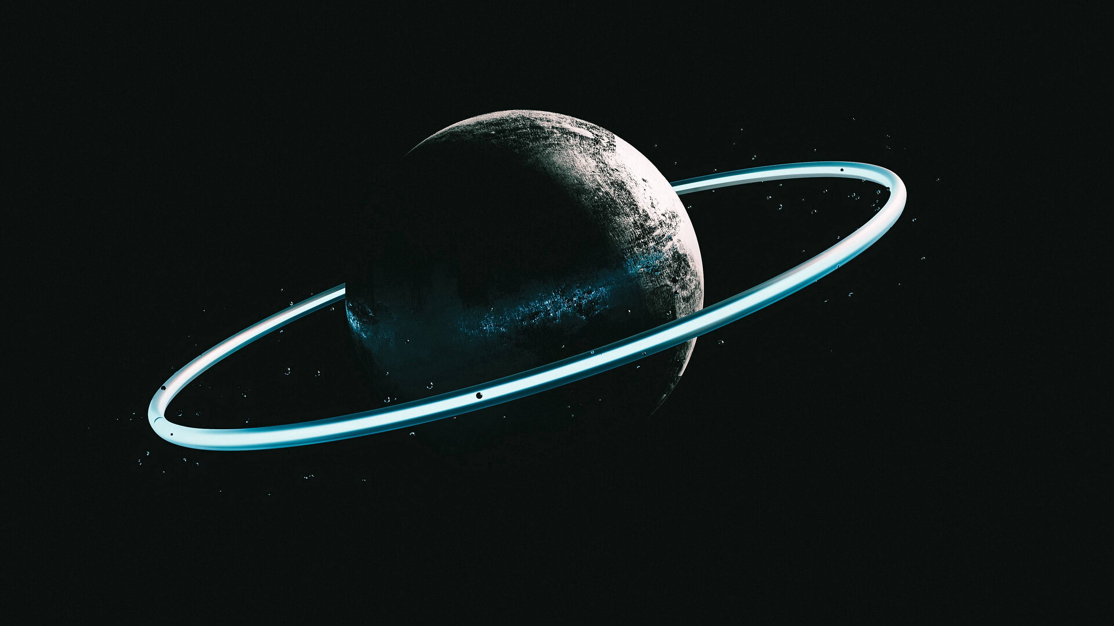 the ring 桌布 壁紙 — 一顆孤獨的行星帶著發光的青色環在廣闊黑暗的太空中運行。