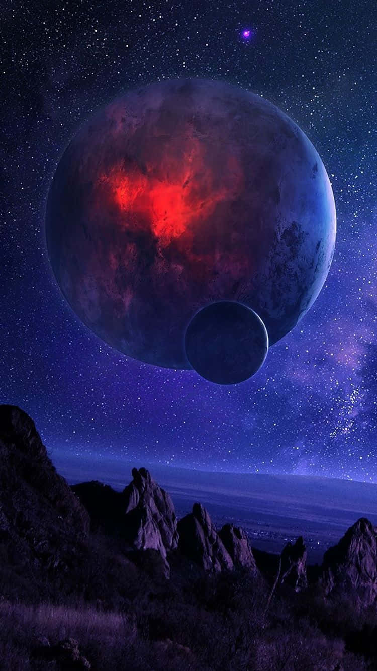 宇宙 桌布 壁紙 — 一顆巨大的行星，帶有發光的紅色心形核心，籠罩在鋸齒狀的山脈之上，背景是繁星點點的宇宙天空。