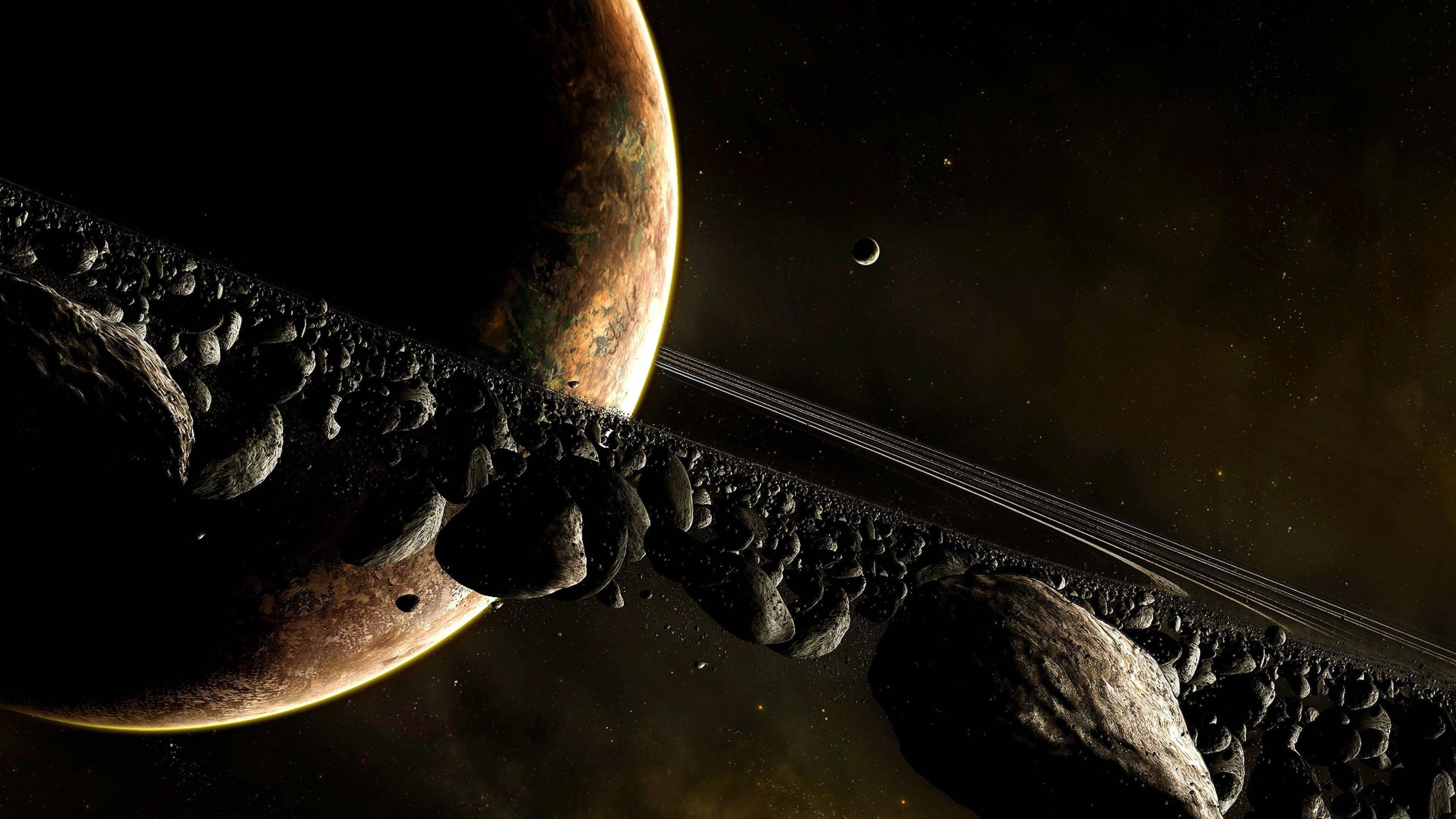 土星 桌布 壁紙 — 一顆帶有光環和衛星的巨大行星，在深空的小行星帶上空隱現。