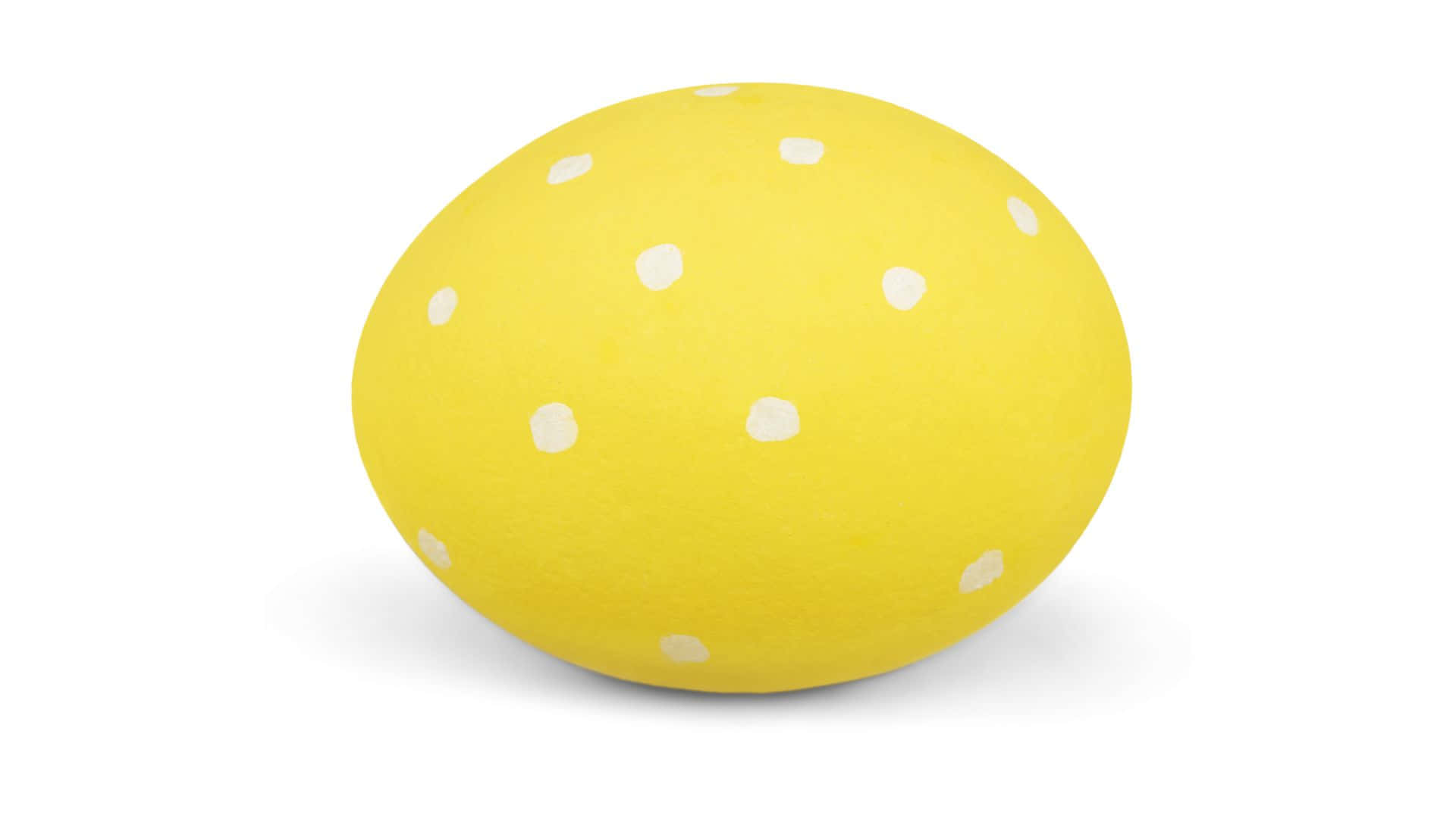 Polka Dot 桌布 壁紙 — 一顆帶有白色圓點的亮黃色雞蛋，置於潔白背景中央。