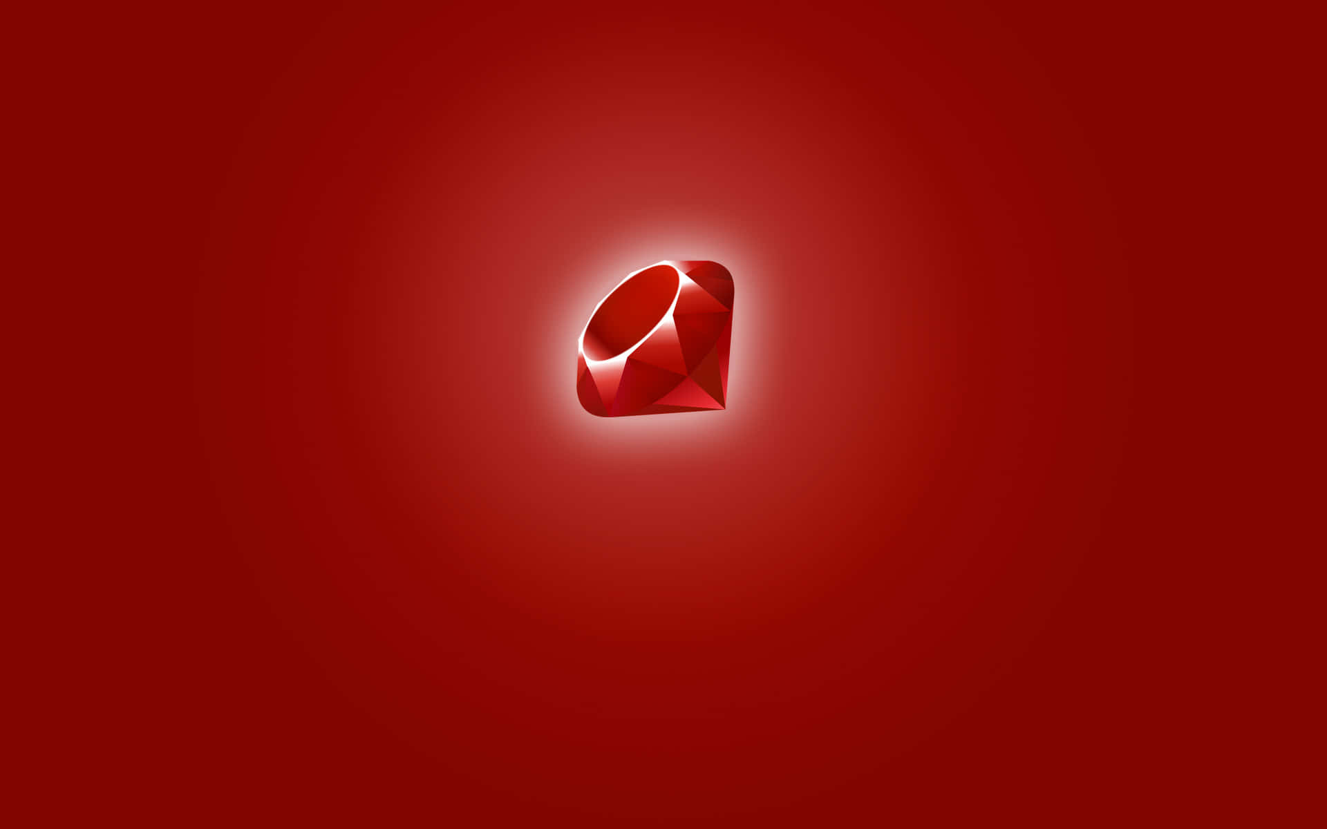 Ruby 桌布 壁紙 — 一顆帶有銳利刻面的發光紅色寶石，在漸變深紅色背景上散發光芒。