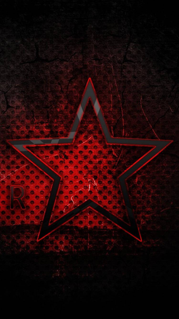Red Star 桌布 壁紙 — 一顆帶黑色輪廓的發光紅星主導了帶有穿孔紋理和微妙文字的裂紋深色背景。