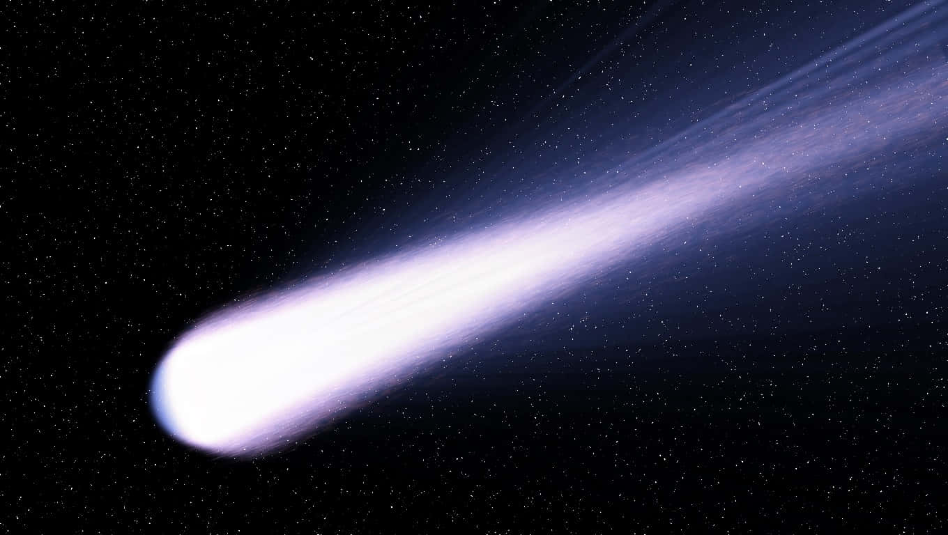 comet 桌布 壁紙 — 一顆明亮的彗星劃過繁星點點的夜空，留下一條發光的紫藍色尾巴。