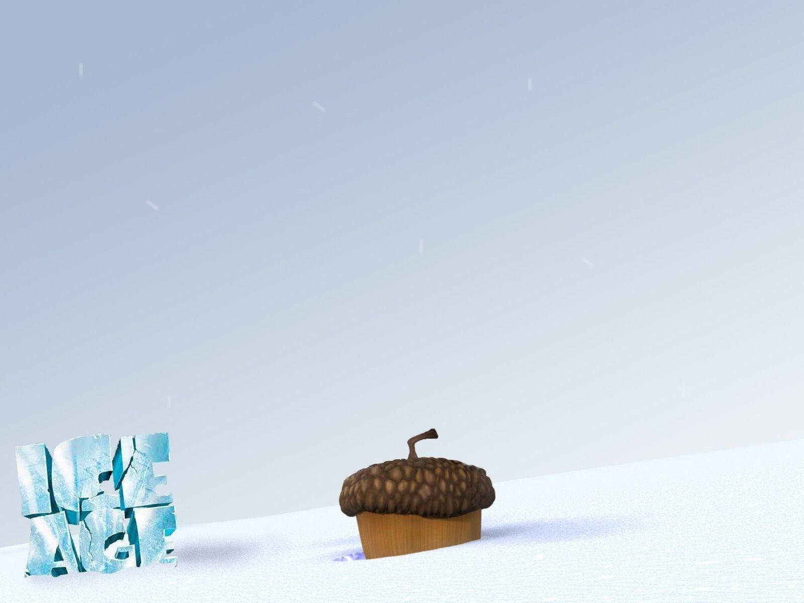 皮克斯 桌布 壁紙 — 一顆橡實安放在純淨的雪地上，旁邊是冰冷的「ICE AGE」字樣，背景是蒼白的冬日天空。
