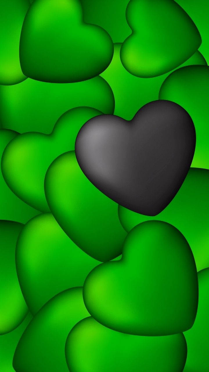 Green Heart 桌布 壁紙 — 一顆深色心形漂浮在鮮綠色心形之間，形成閃亮的3D渲染抽象圖案。