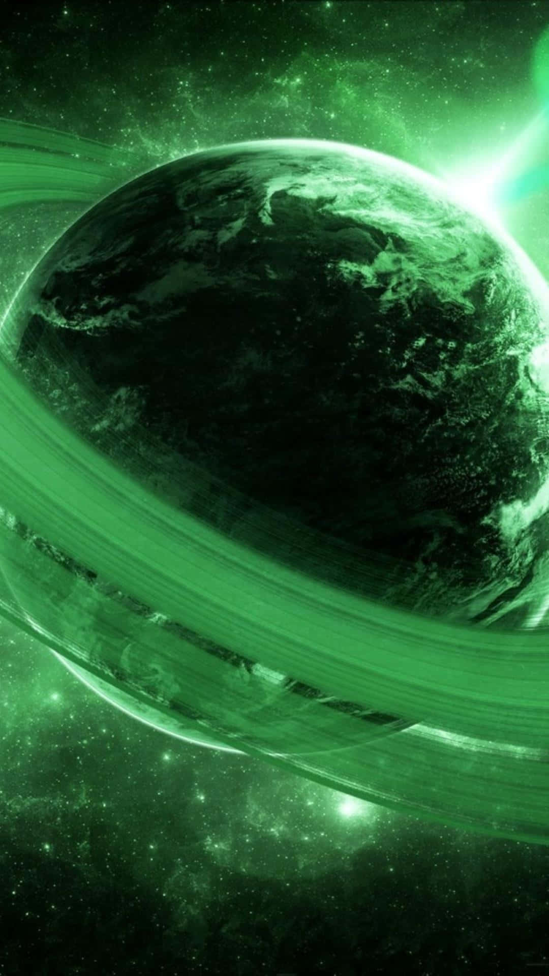 Green Galaxy 桌布 壁紙 — 一顆發光的綠色行星帶有光環，在星光燦爛的宇宙廣袤中運行，沐浴在空靈的霓虹光芒中。