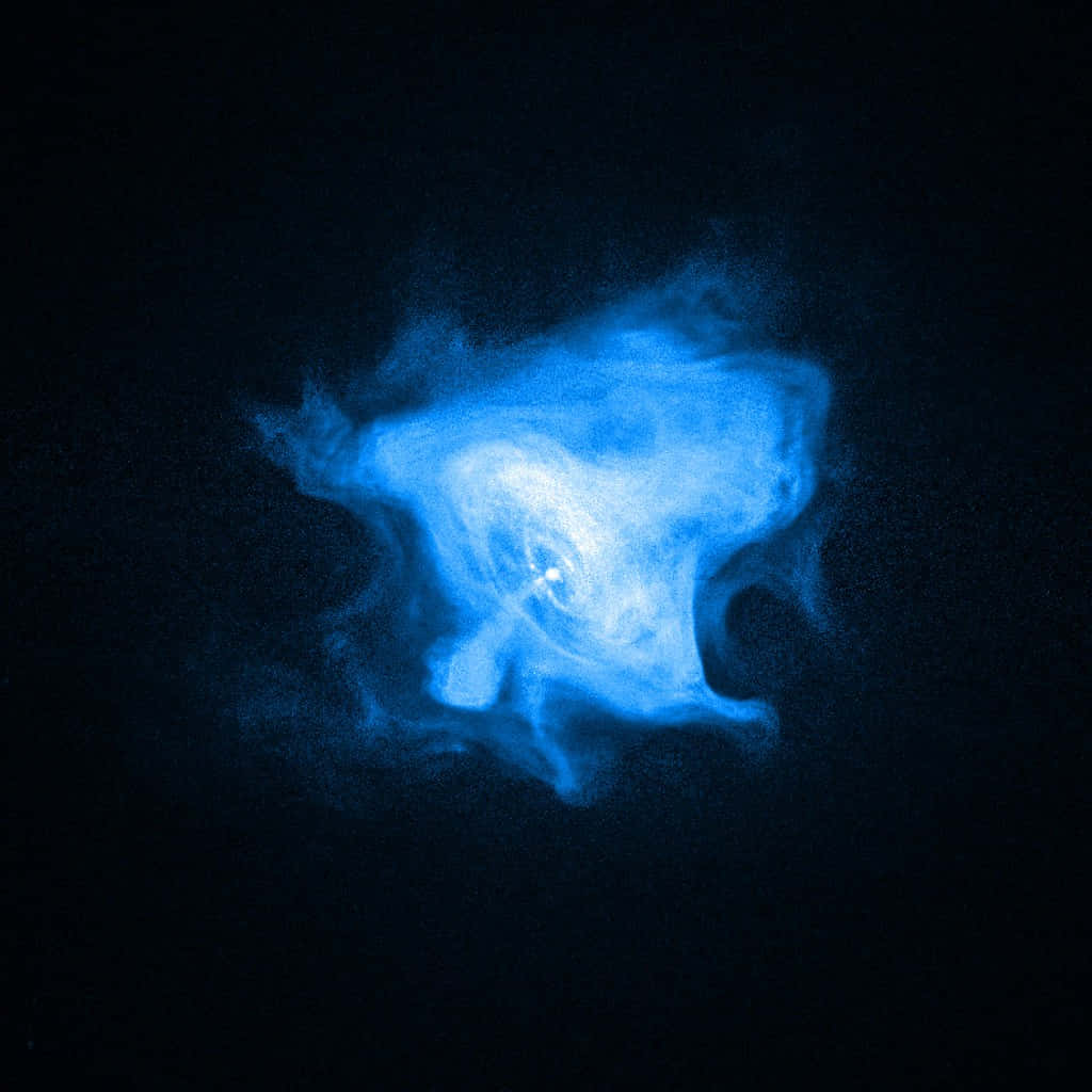Patronus 桌布 壁紙 — 一顆發光的藍色星雲在深邃的黑色宇宙虛空中旋轉，呈現出令人驚嘆的太空照片。