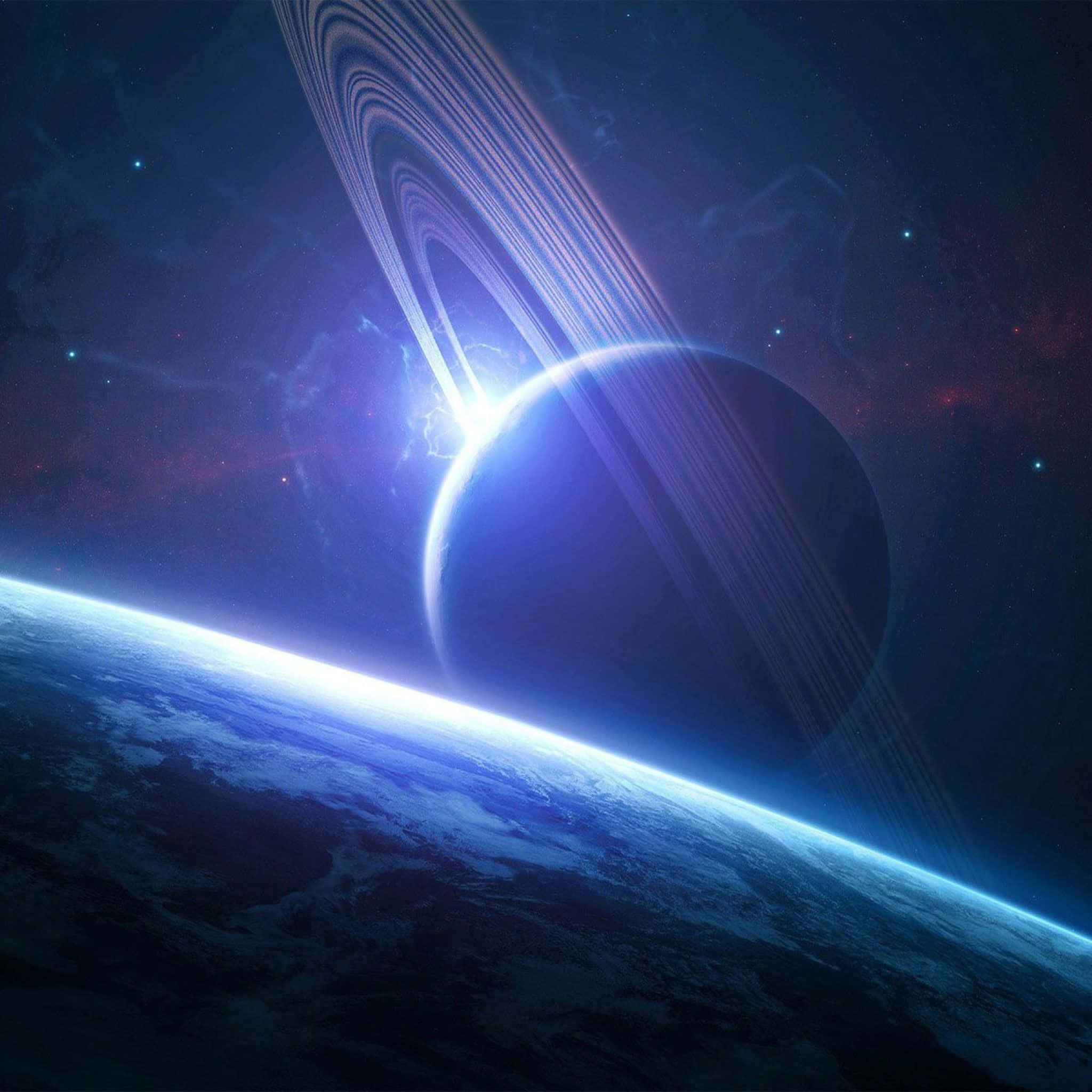 桌布 壁紙 — 一顆發光的藍色行星帶有光環，在星空宇宙背景下繞著地球彎曲的地平線運行。