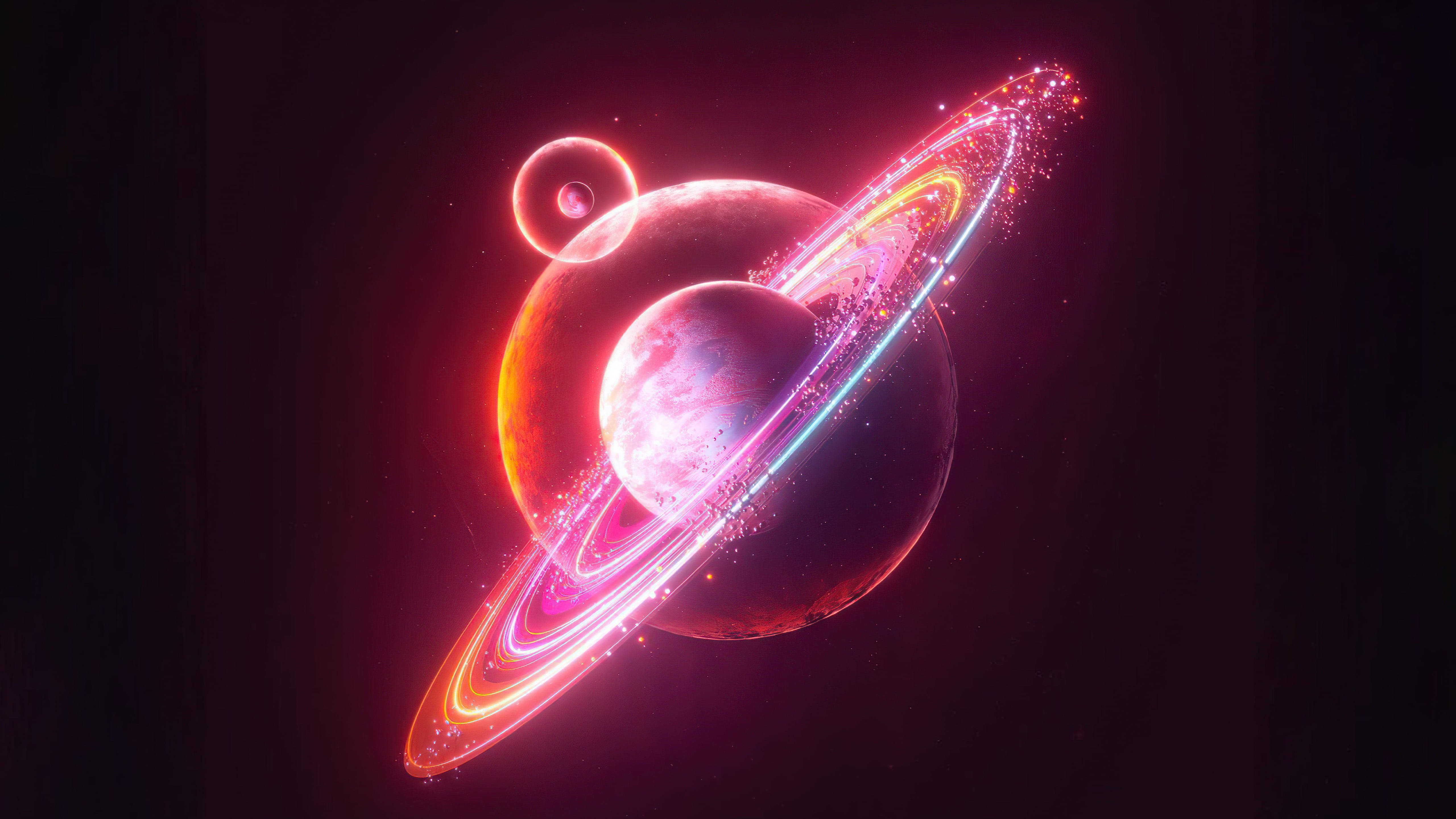 太空 桌布 壁紙 — 一顆發光的行星帶有鮮豔的粉紅色和橙色環，在黑暗的宇宙背景下運行，附近有一顆較小的衛星。