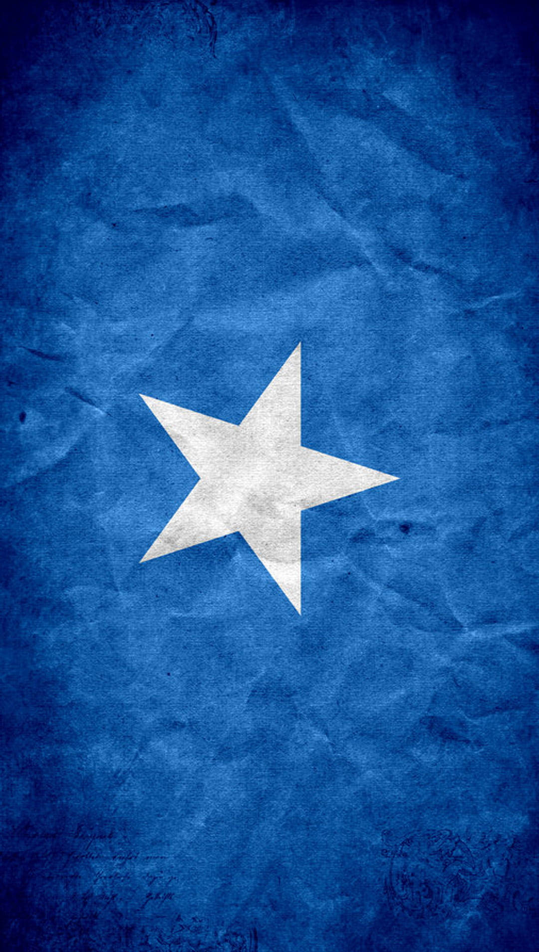 Somalia 桌布 壁紙 — 一顆白色五角星位於質感深藍色背景中央，類似皺褶布料。
