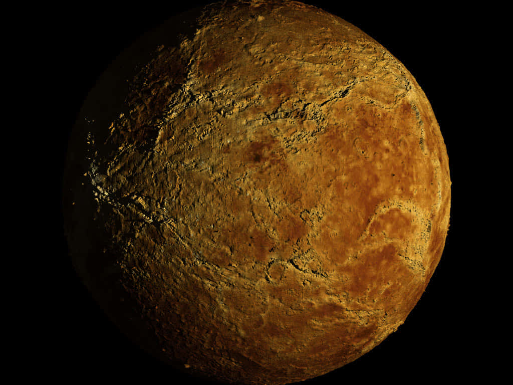 Venus 桌布 壁紙 — 一顆粗糙紋理的行星，帶有金棕色地殼和黑色裂縫，在黑色虛空中發光。