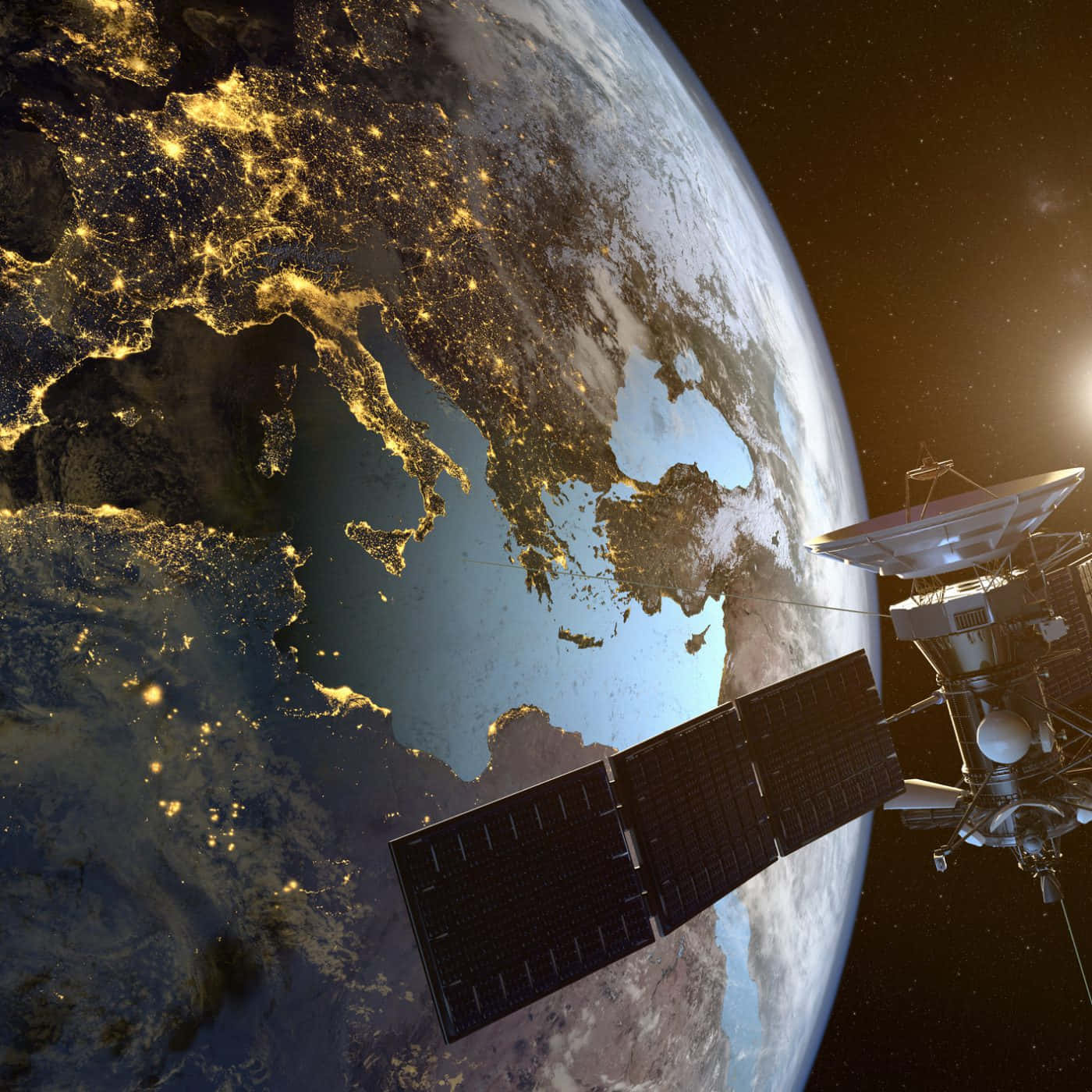 Satellite 桌布 壁紙 — 一顆衛星在夜間繞地球運行，在繁星點點的黑色天空下展現歐洲和非洲閃爍的城市燈光。