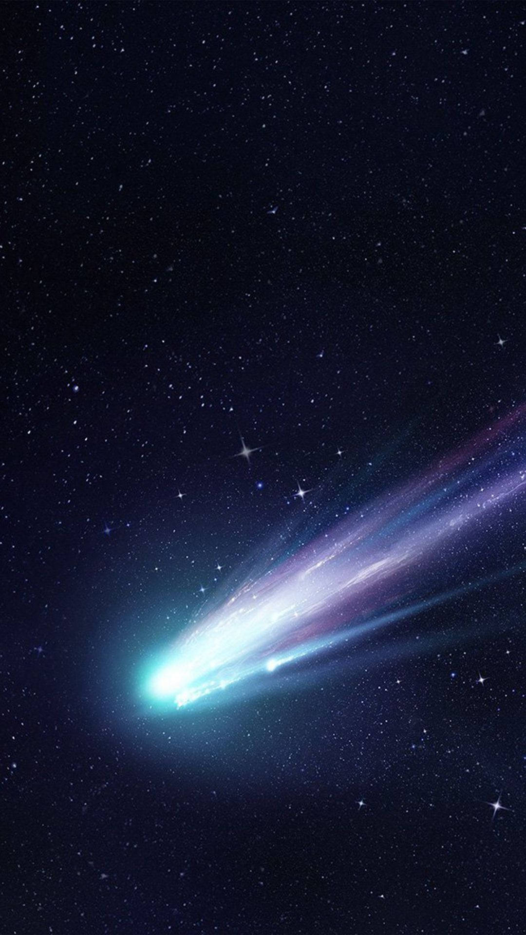 Star Space 桌布 壁紙 — 一顆閃亮的彗星劃過繁星點點的夜空，留下一條發光的紫色和藍色尾巴。