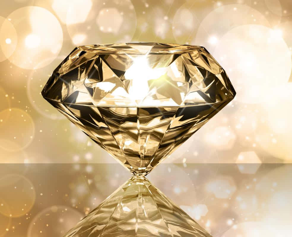 Yellow Diamond 桌布 壁紙 — 一顆閃耀的金色鑽石，在溫暖燈光和閃爍的柔和散景背景下，展現出銳利的切面光芒。