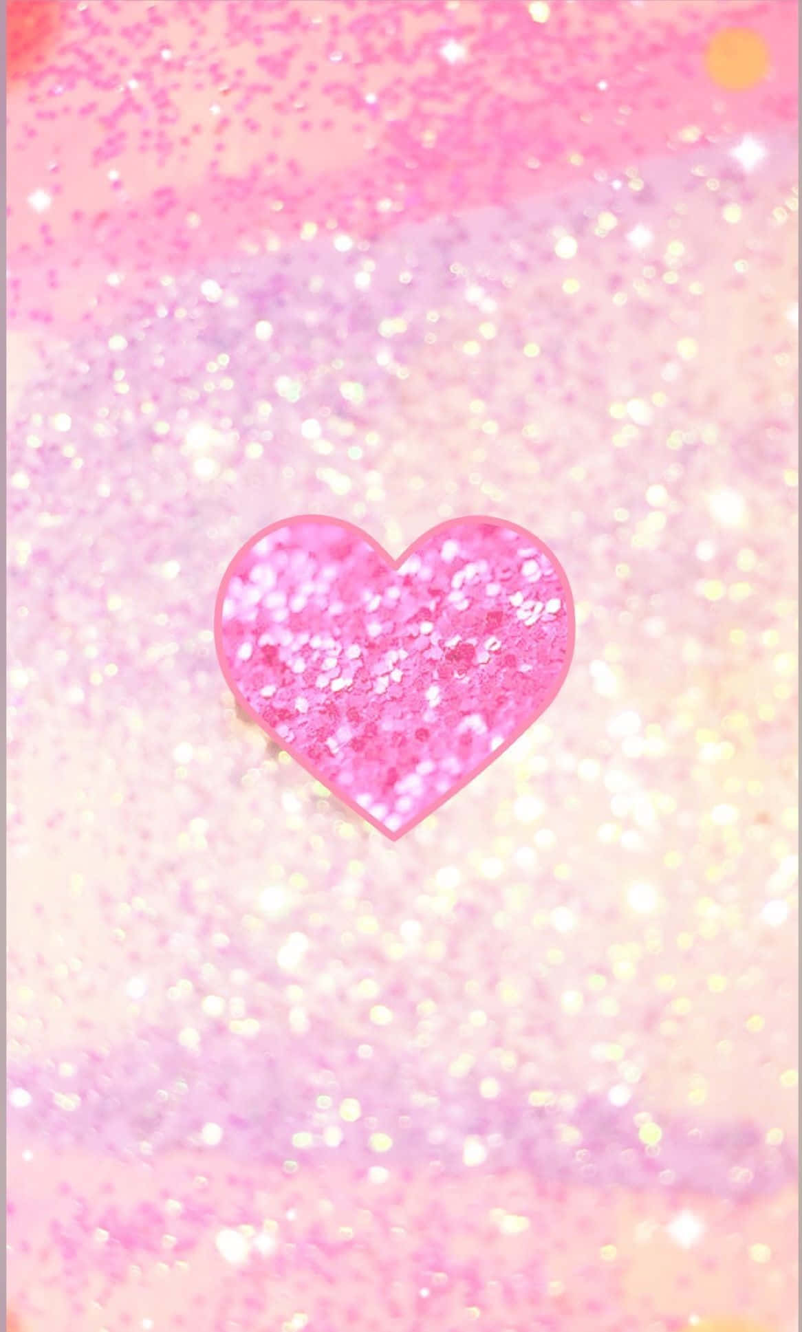 Glitter Pink Hearts 桌布 壁紙 — 一顆閃閃發光的粉紅色心形漂浮在粉彩粉紅和黃色的閃爍漸變背景中，帶有散景燈光。