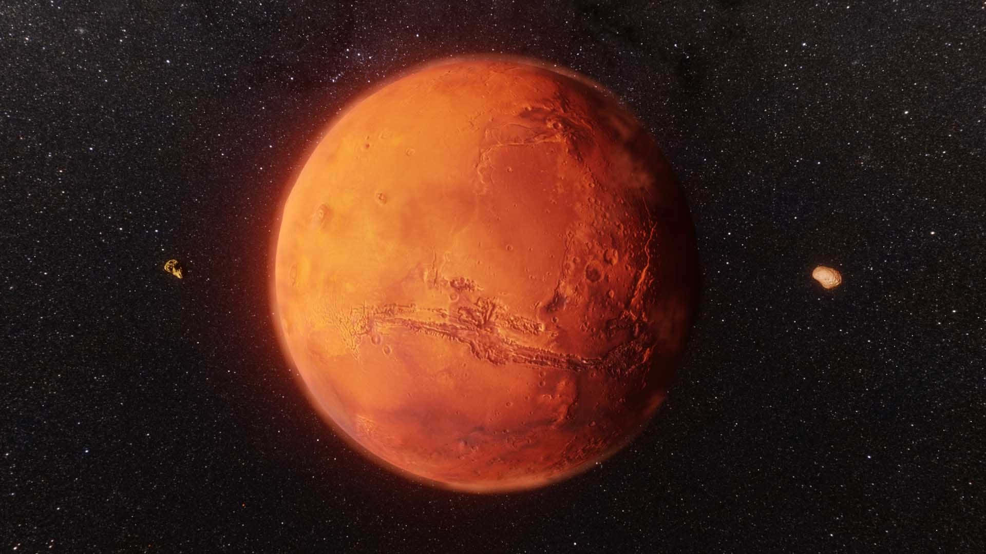 Mars Planet 桌布 壁紙 — 一顆鮮豔的橙色火星主宰著佈滿星星的黑色天空，附近有兩顆小衛星在軌道上運行。