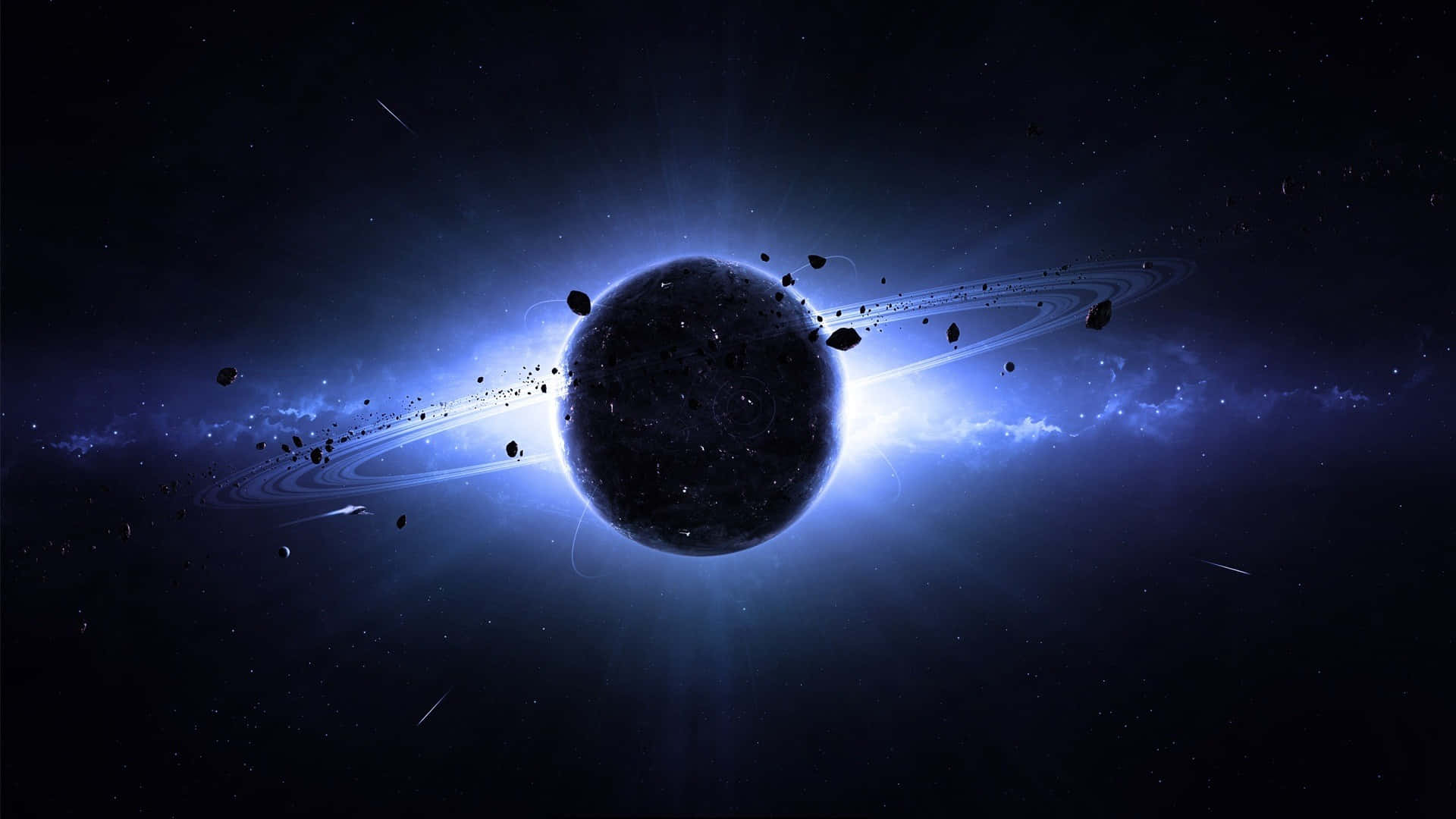 土星 桌布 壁紙 — 一顆黑暗的行星，帶有發光的藍色光環和漂浮的小行星，被燦爛的宇宙光照亮，背景是繁星點點的虛空。