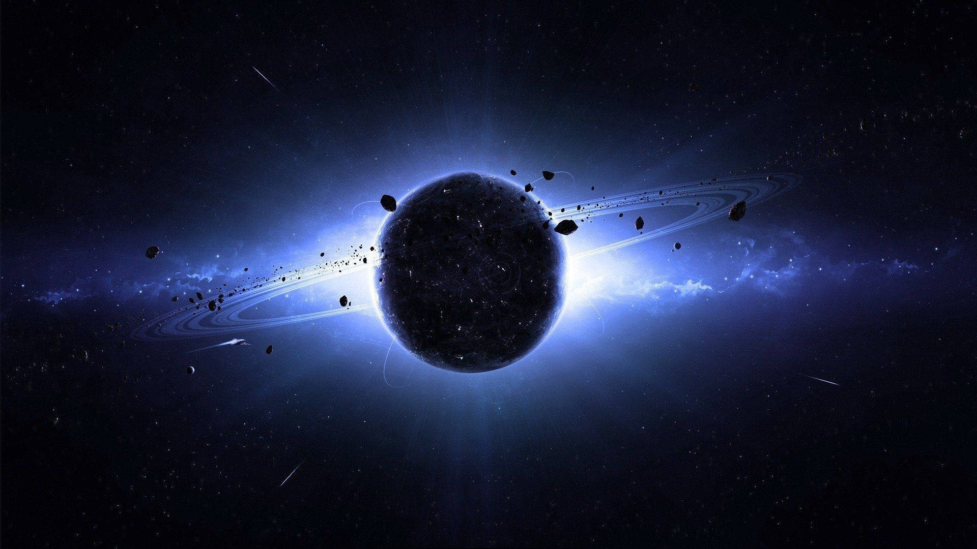 太空美學動圖 桌布 壁紙 — 一顆黑暗行星，帶有發光的藍色光環和漂浮的小行星，沐浴在宇宙光中，背景是繁星點點的虛空。