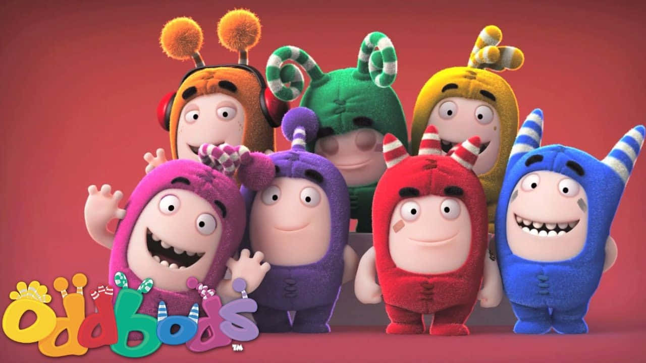 Animated Cartoon 桌布 壁紙 — 七個色彩繽紛、毛茸茸的卡通人物，戴著獨特的帽子和表情，在純紅色背景前愉快地擺姿勢。