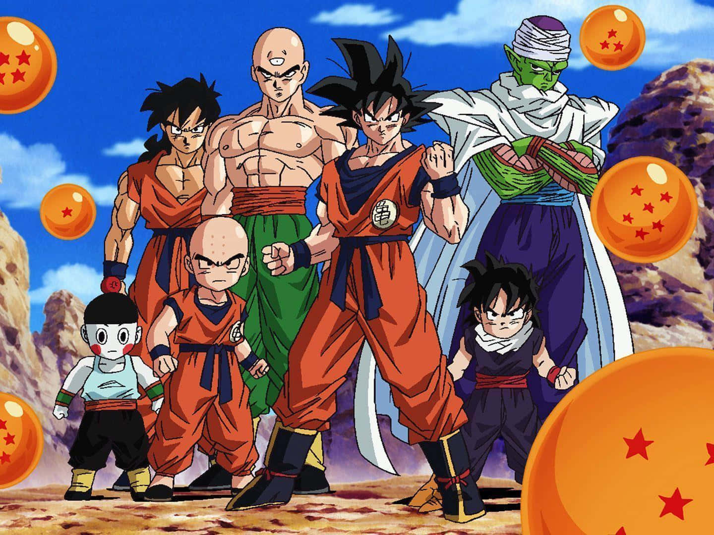 Dragon Ball Z Kai 桌布 壁紙 — 七個龍珠角色英雄式地站在岩石地形上，天空湛藍，漂浮著橙色龍珠。