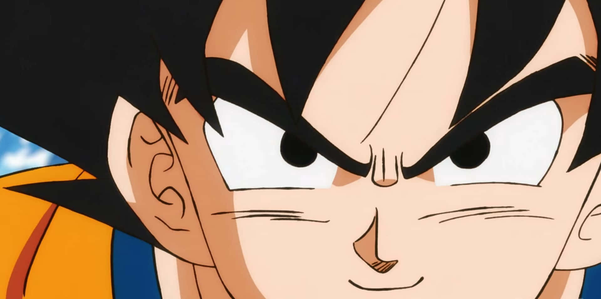 Dragon Ball Movies 桌布 壁紙 — 七龍珠中悟空的近距離特寫，眼神銳利、表情兇猛，背景為藍天。