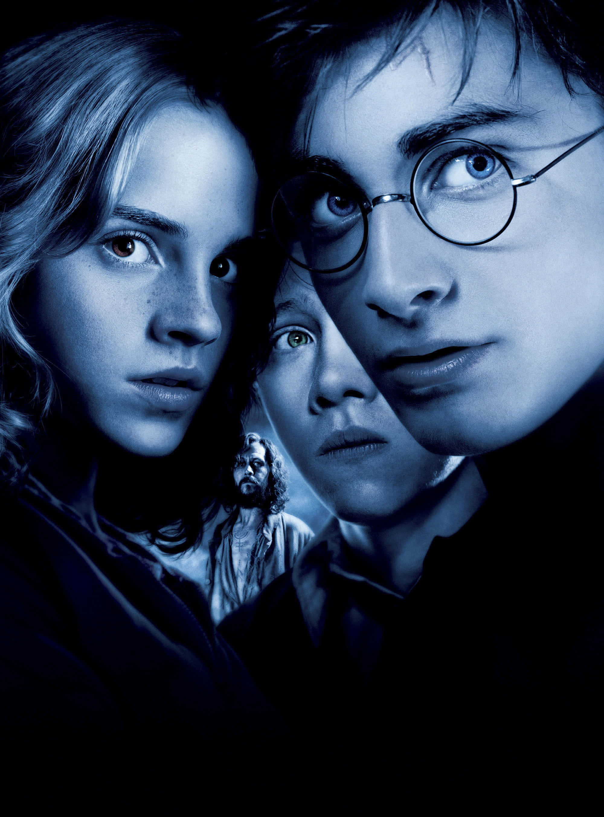 Ron Weasley 桌布 壁紙 — 三位年輕巫師在黑暗背景下，於冷藍色燈光中帶著強烈表情向前凝視。