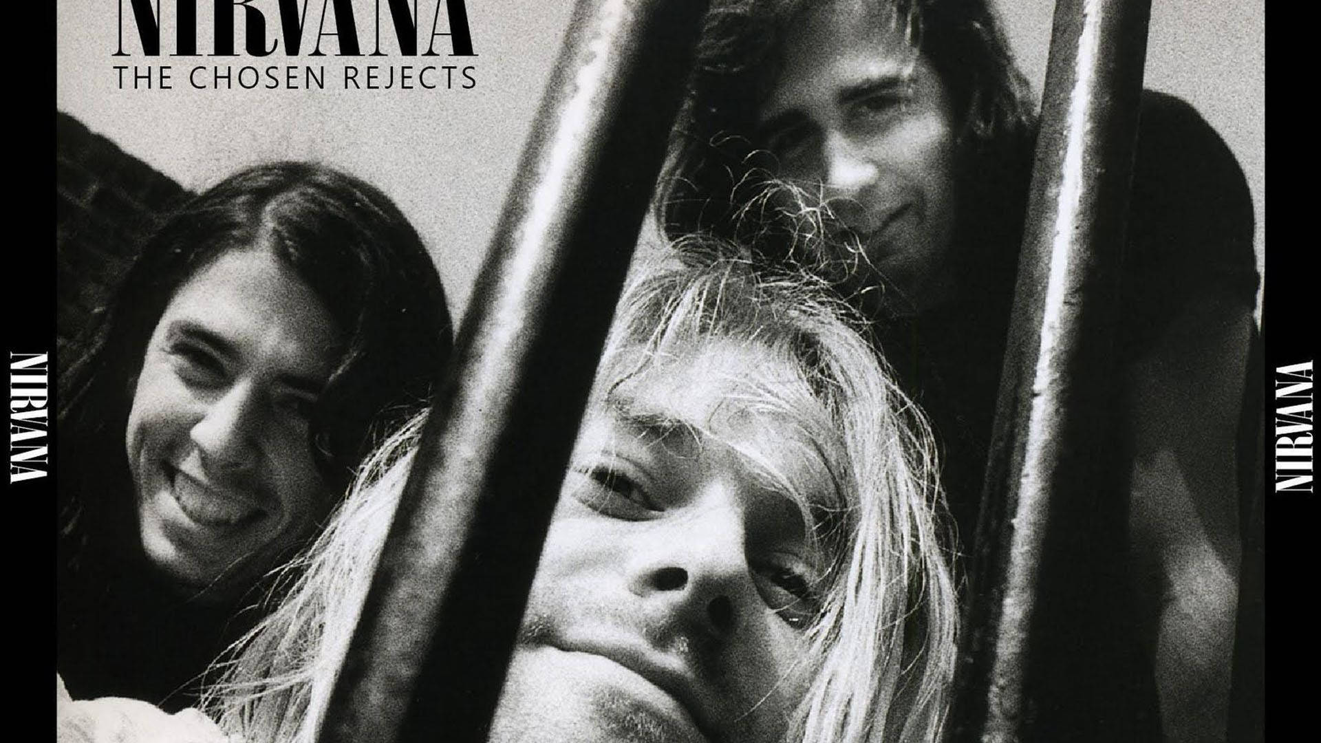 nirvana 4K 桌布 壁紙 — 三位樂團成員透過金屬欄杆凝視，一張黑白照片中帶有強烈表情。