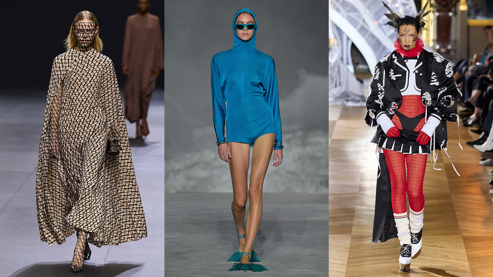 Runway 桌布 壁紙 — 三位模特兒穿著前衛服裝走秀：幾何斗篷、藍色連體衣和大膽的紅黑套裝。