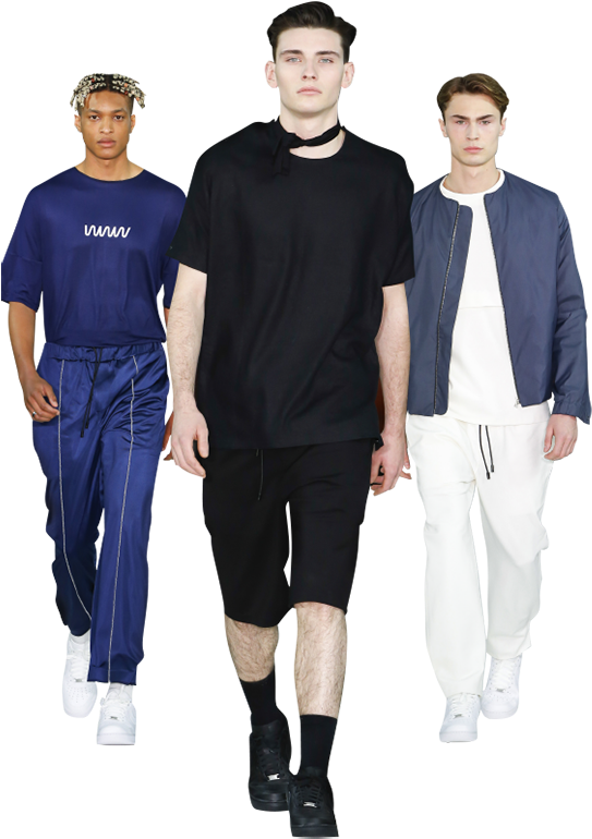 Mens Fashion 桌布 壁紙 — 三位身穿現代街頭服飾的男士在純黑背景前擺姿勢，展現大膽的色彩對比和極簡時尚。