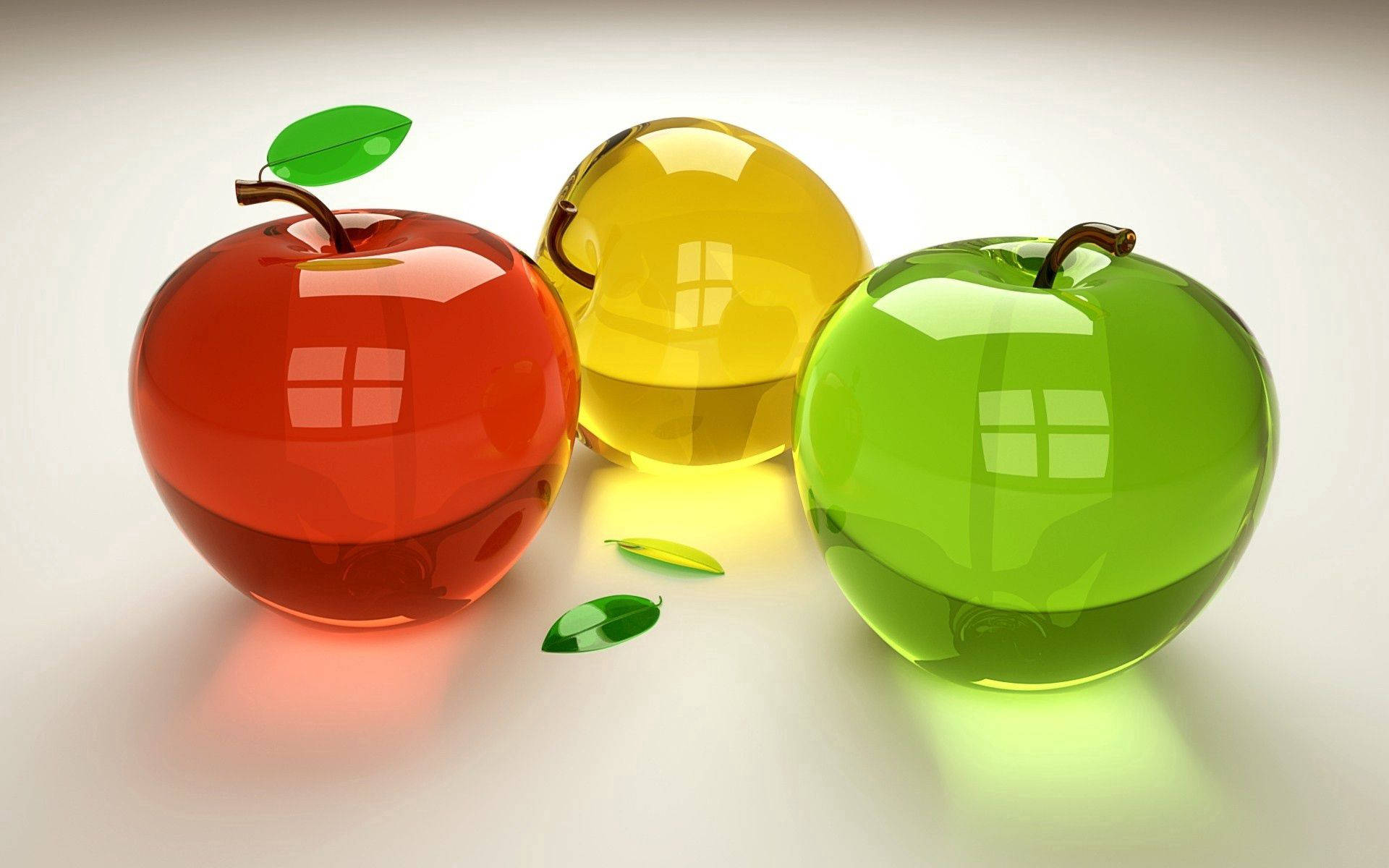 Fruit 桌布 壁紙 — 三個光澤玻璃蘋果，紅色、黃色和綠色，在潔白的表面上反射窗戶。