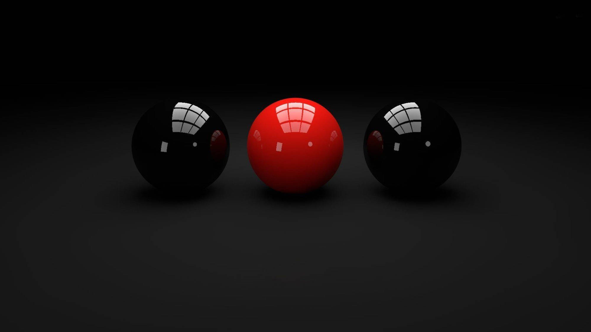 Snooker 桌布 壁紙 — 三個光澤球體，一個紅色兩個黑色，在深色漸變表面上反射網格光。