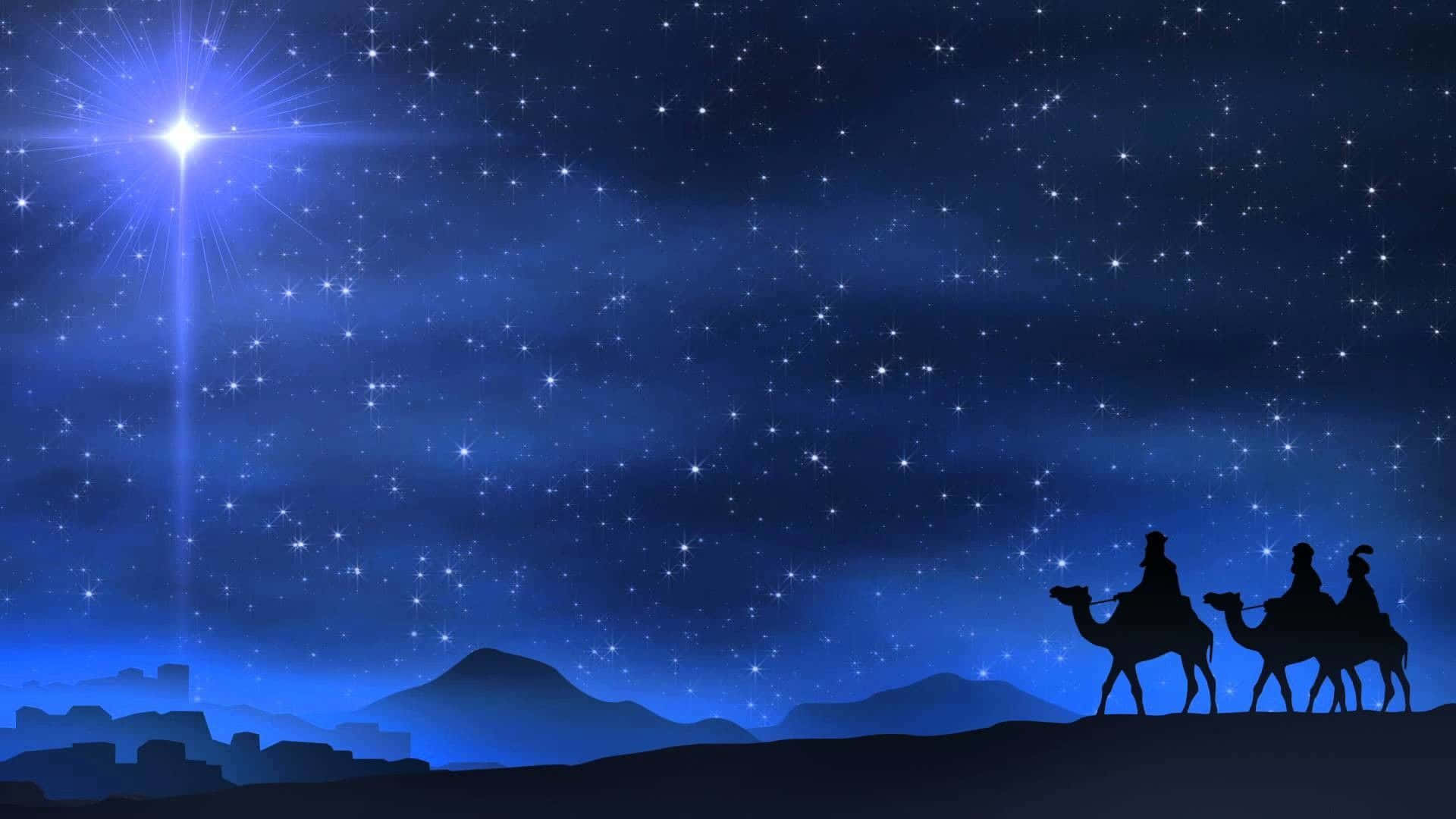 Nativity Scene 桌布 壁紙 — 三個剪影人物騎著駱駝穿越沙漠，夜空繁星點點，一顆明亮的引導星主導著天際。
