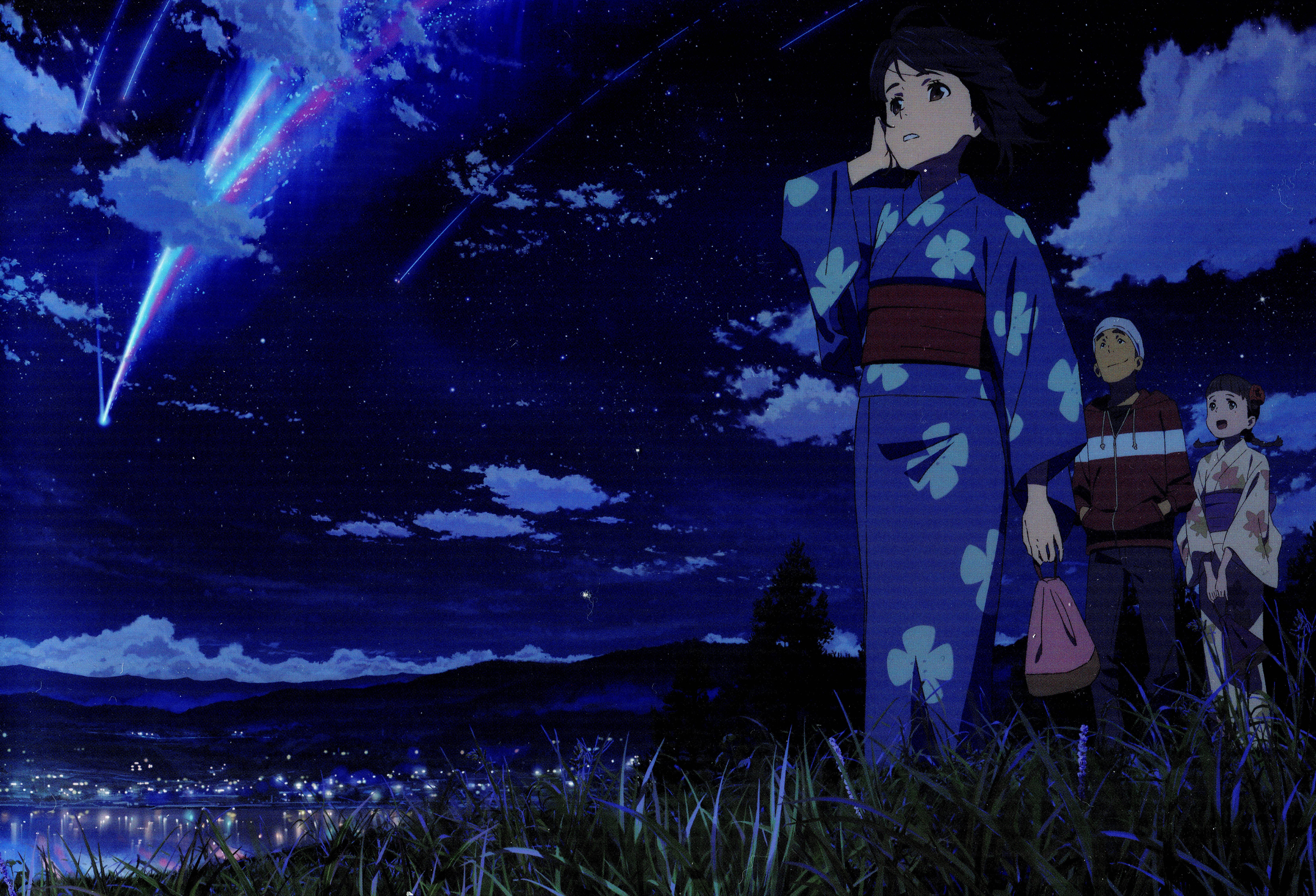 Your Name 桌布 壁紙 — 三個動漫角色仰望璀璨流星雨劃過繁星點點的夜空，下方是一座發光的小鎮。