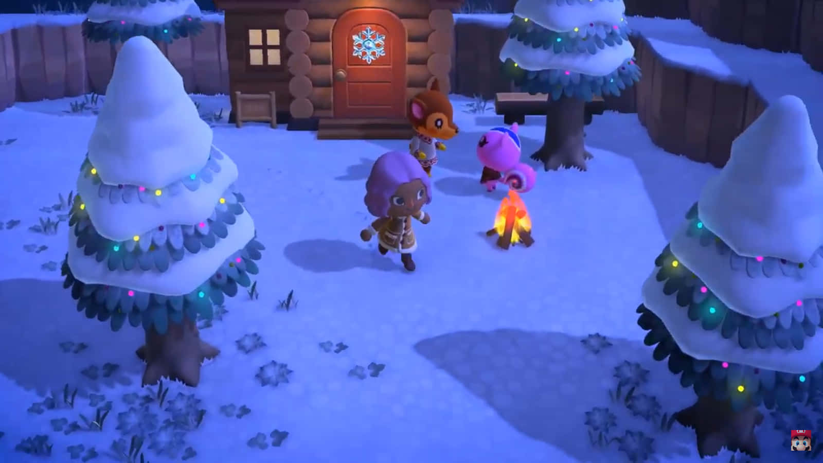 桌布 壁紙 — 三個動畫動物角色在雪夜村莊中圍著營火，周圍有裝飾樹木和木屋。