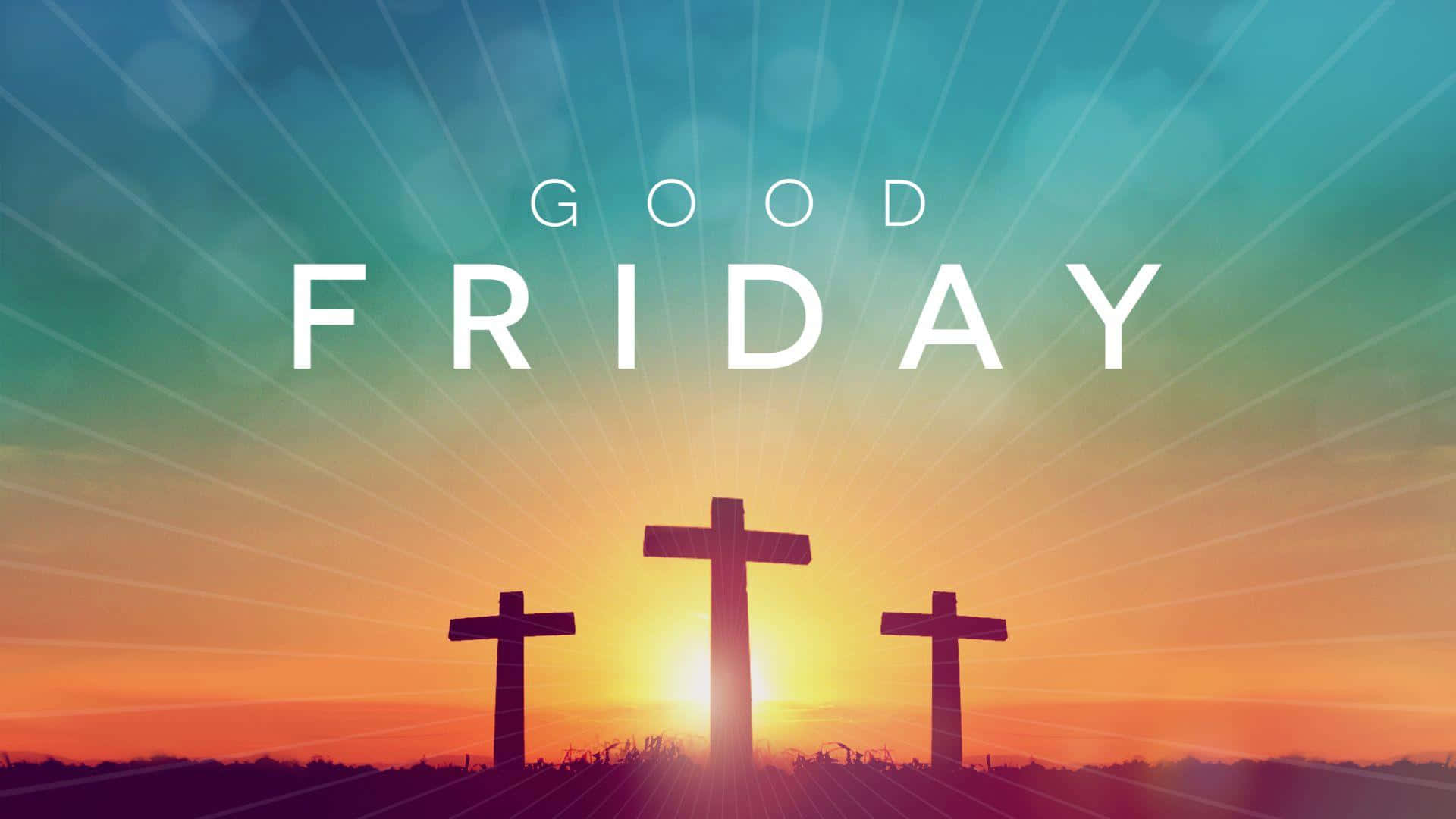 Good Friday 桌布 壁紙 — 三個十字架剪影映襯著燦爛的日落天空，上方閃耀著「GOOD FRIDAY」字樣。