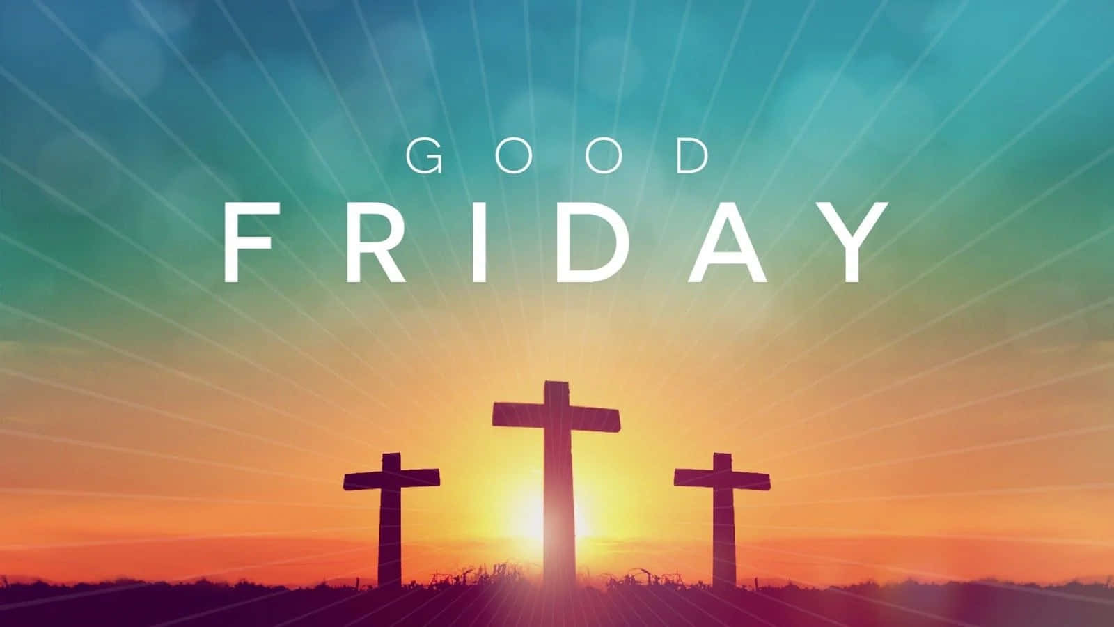 Good Friday 桌布 壁紙 — 三個十字架在燦爛的日落天空下呈現剪影，上方有 'GOOD FRIDAY' 文字發光。