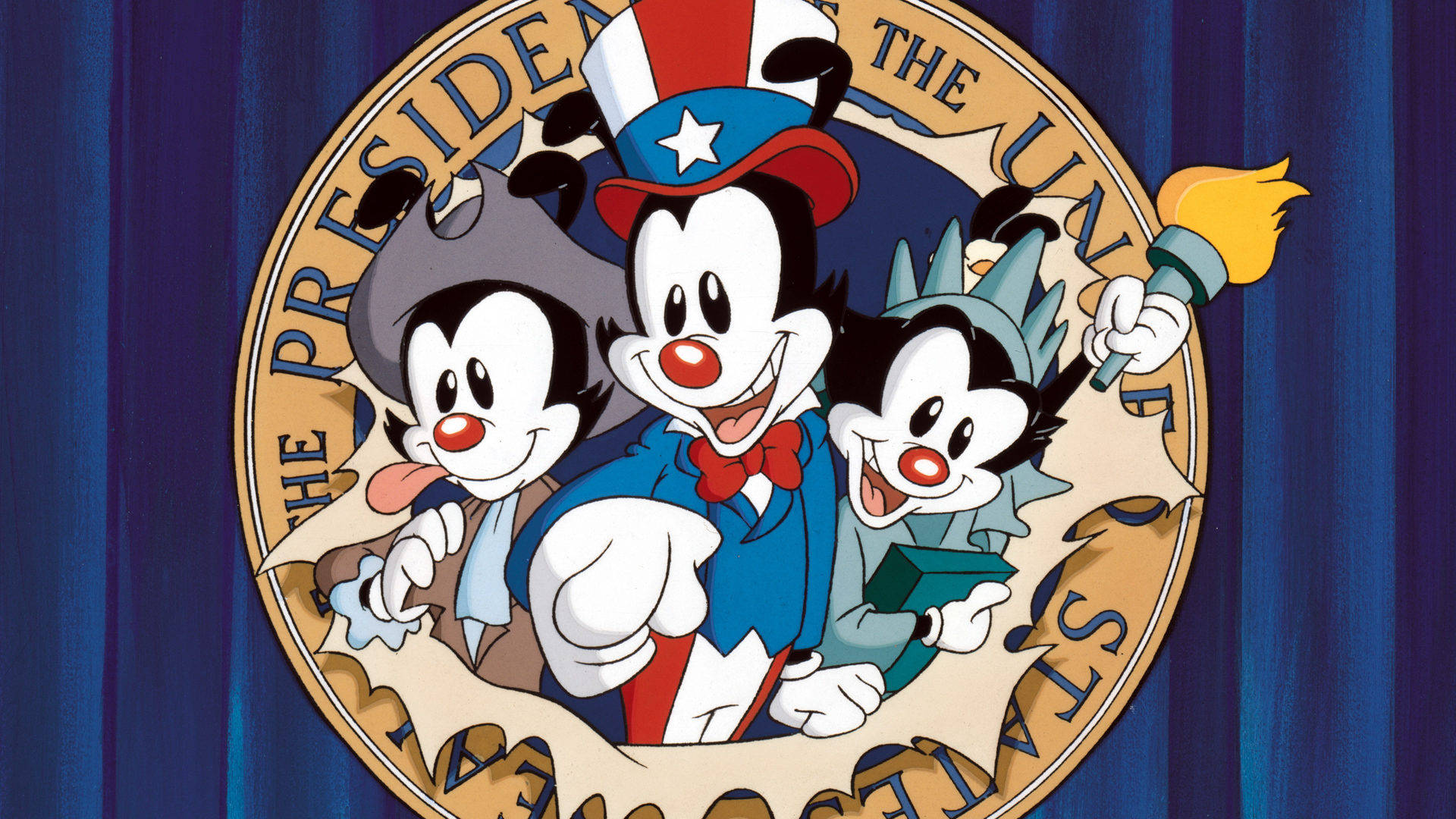 Animaniacs 桌布 壁紙 — 三個卡通人物穿著愛國服裝，在藍色窗簾背景下的總統印章內愉快地擺姿勢。