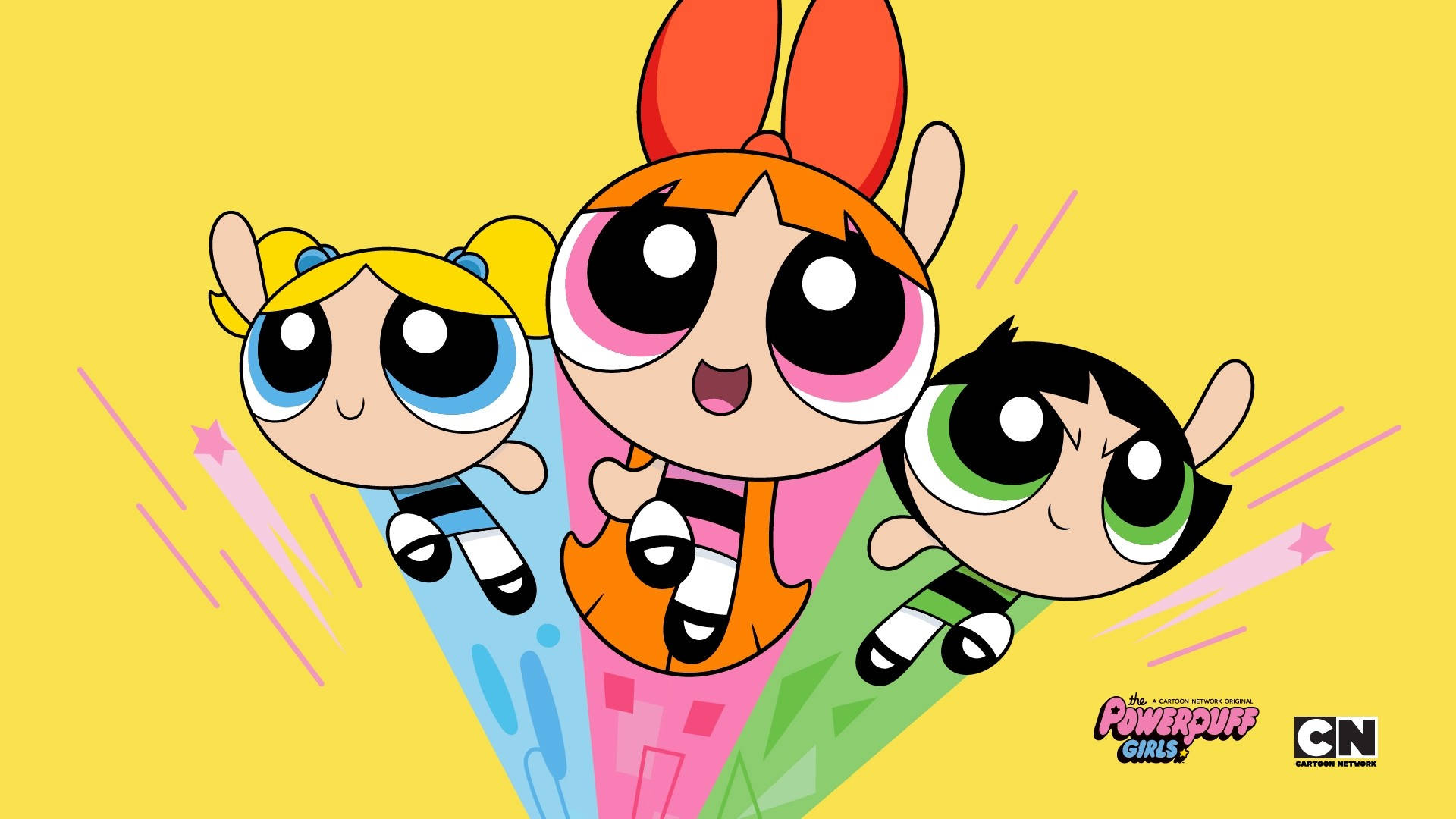 Cartoon Network Characters 桌布 壁紙 — 三個卡通女孩，眼睛超大，在明亮的黃色背景上帶有粉紅色條紋，動態飛翔。