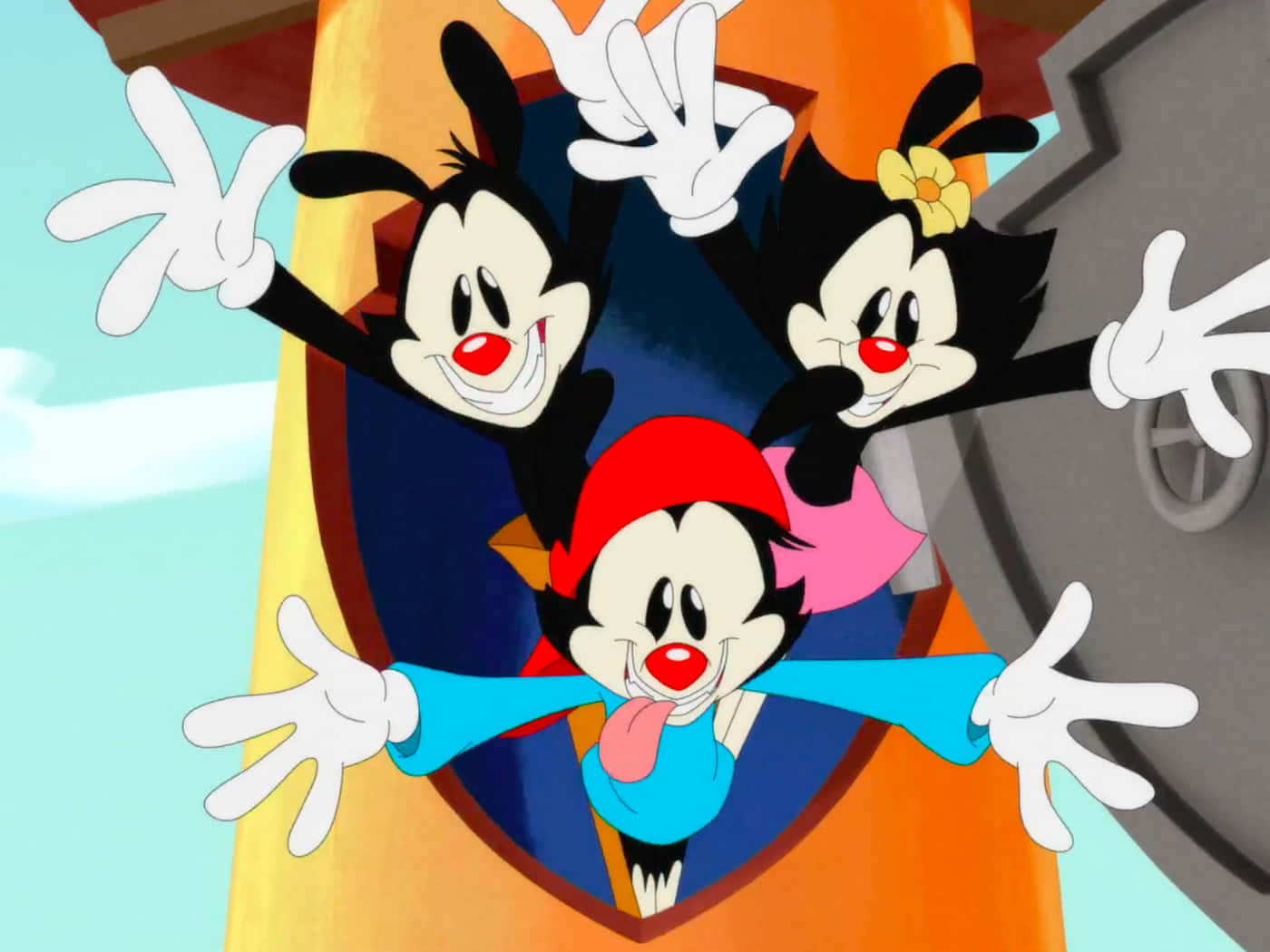 Animaniacs 桌布 壁紙 — 三個卡通角色，黑色毛髮、紅色鼻子和白色手套，從色彩繽紛的門口愉快地揮手。
