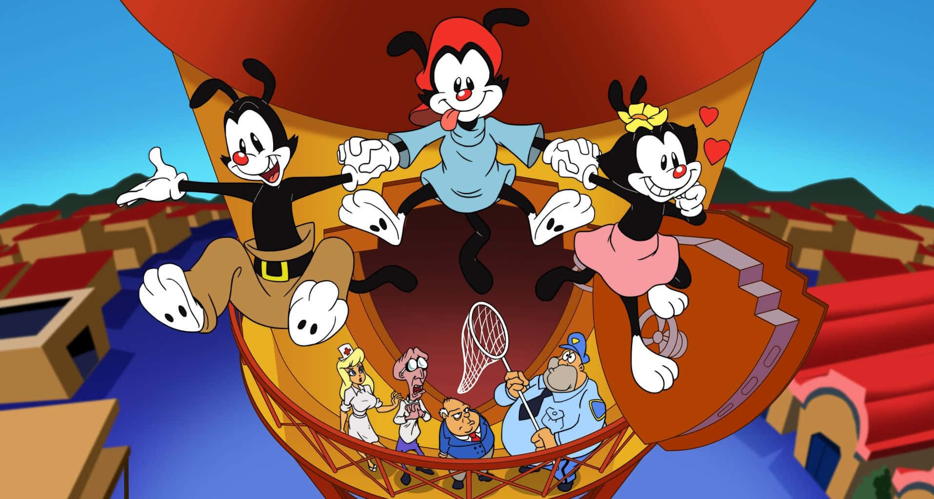 Animaniacs 桌布 壁紙 — 三個卡通角色快樂地掛在一個巨大的熱氣球上，飛越色彩繽紛的小鎮，下方有較小的角色抬頭觀看。