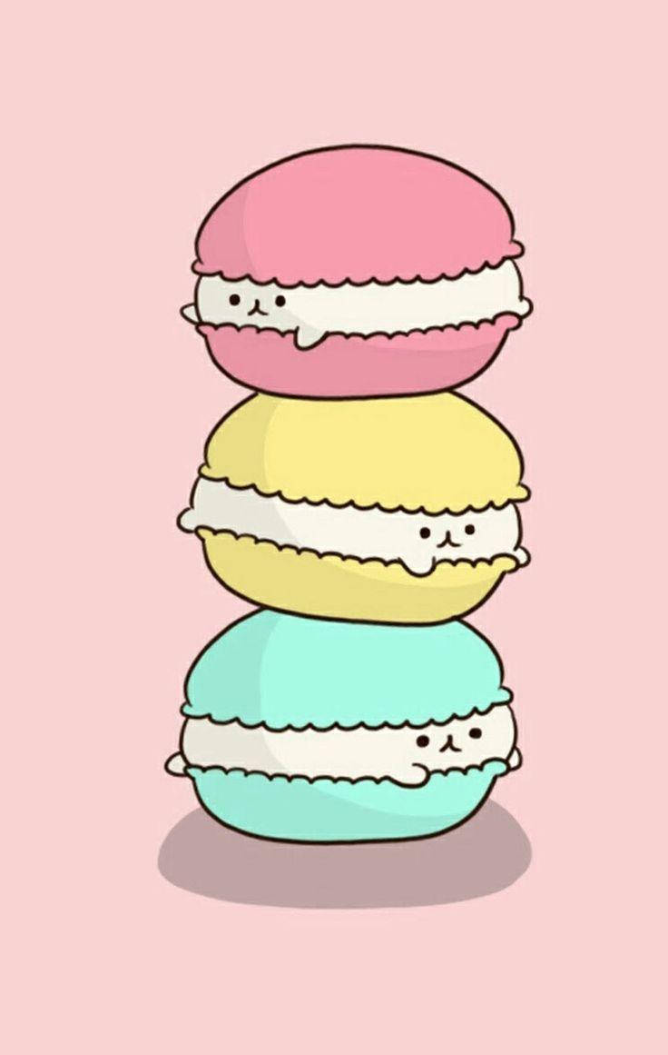 Kawaii iPhone 桌布 壁紙 — 三個可愛卡通馬卡龍帶有表情，垂直堆疊在柔軟的粉紅色背景上。