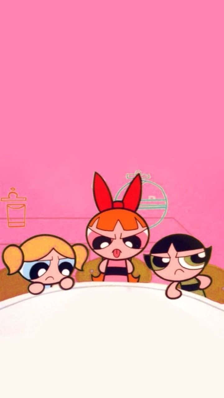 Powerpuff Girls Aesthetic 桌布 壁紙 — 三個大眼睛的卡通女孩在純粉紅色背景上越過壁架偷看。